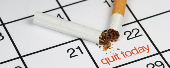 Image of a broken cigarette on a calendar with the words Quit Today written on the 22nd.