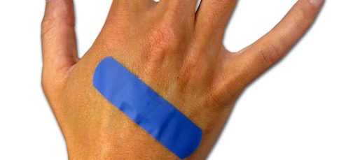 Blue bandage on hand